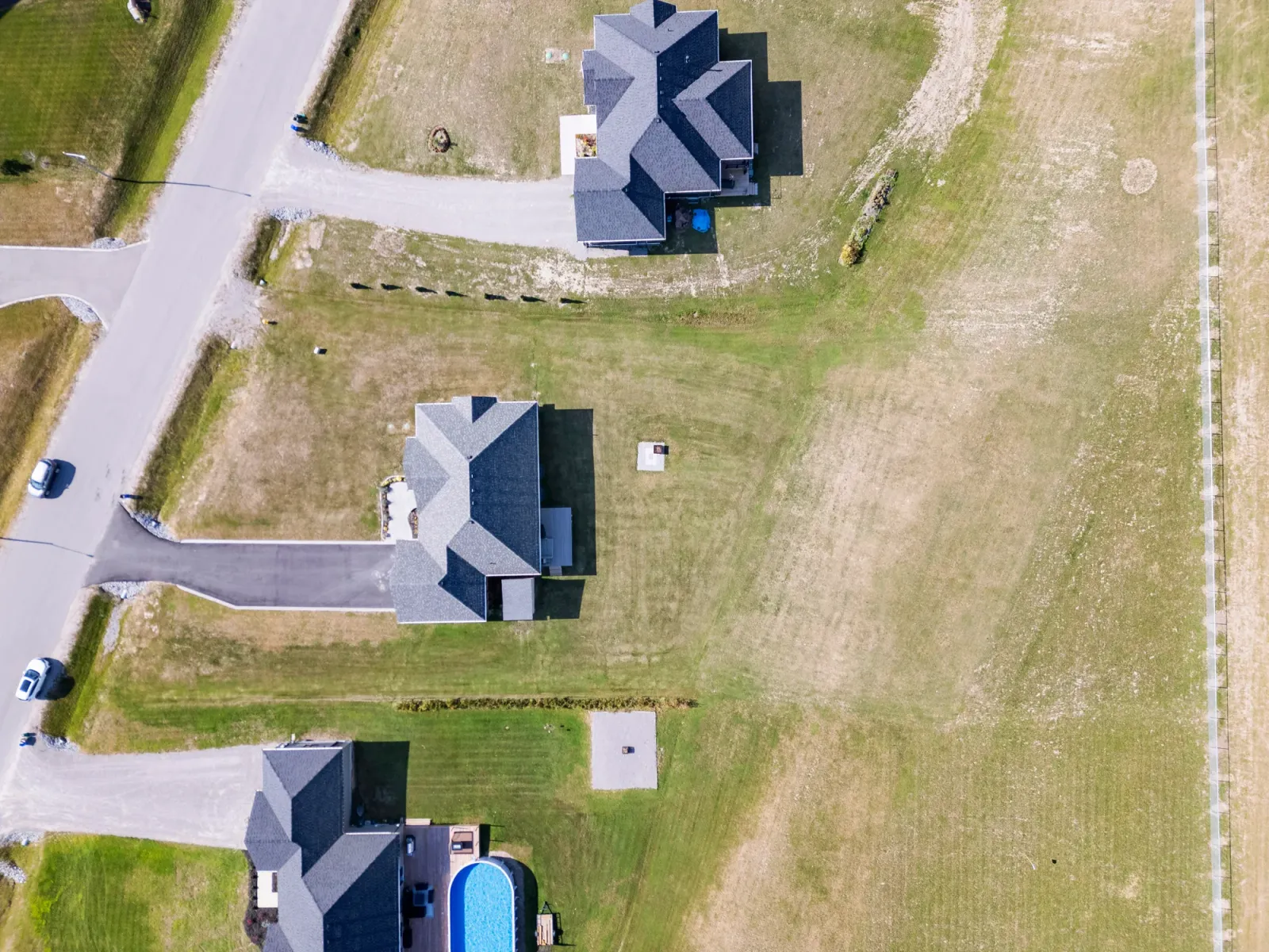OpenDoors360 real estate drone photography, an aerial view of homes and lots, the kind of aerial photography that frames a property and its setting for buyers