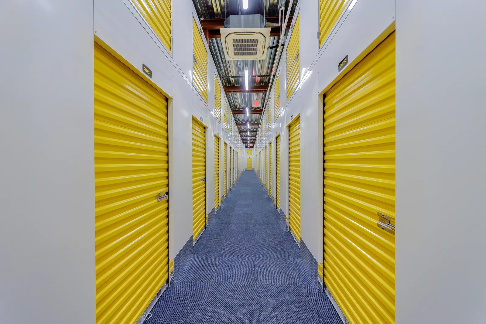 Interior corridor of yellow-door storage units at Life Storage in Brooklyn, New York, commercial real estate photography, by OpenDoors360