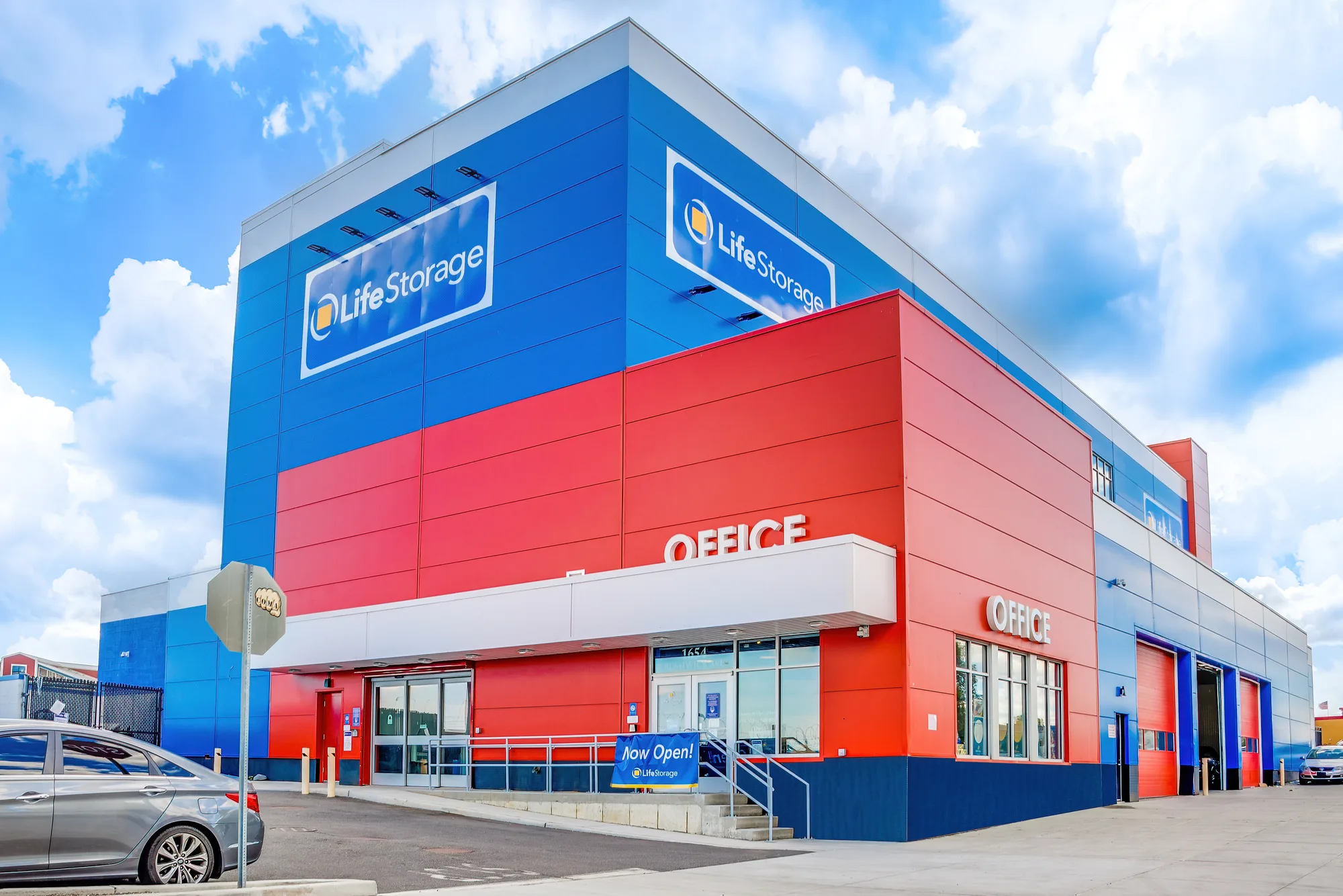 Corner view of bold Life Storage facility with office signage in Bushwick, Brooklyn, New York, commercial real estate photography, by OpenDoors360