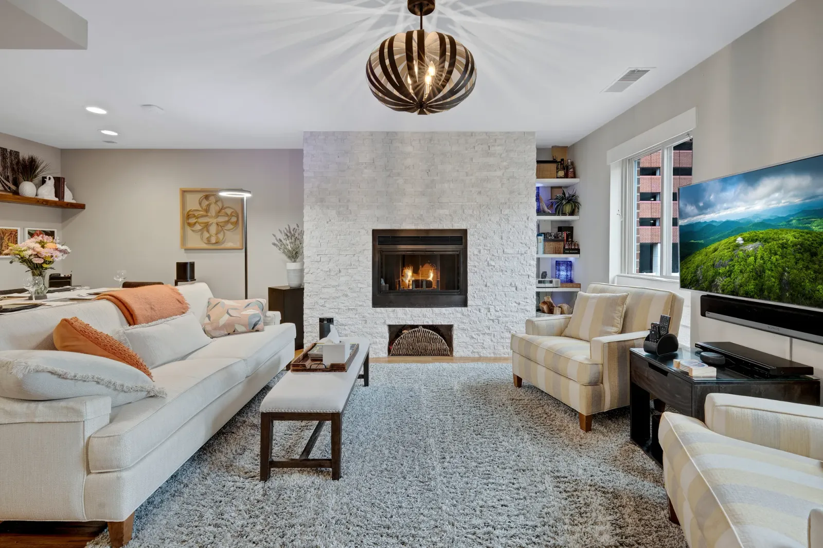 OpenDoors360 professional real estate photography of a staged living room with a stone fireplace, the kind of high quality images that help a property stand out to potential buyers
