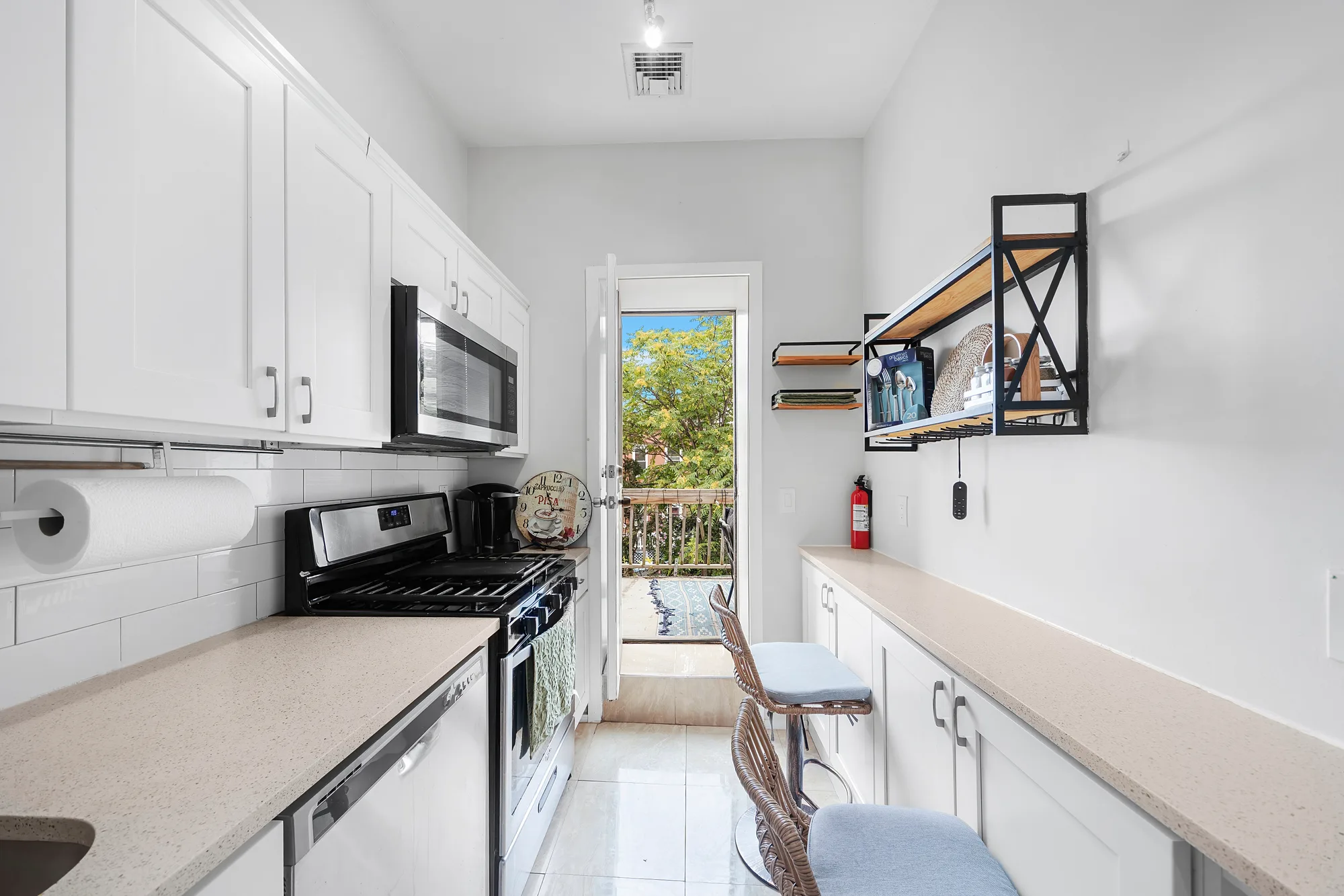 OpenDoors360 HDR real estate photography of a bright white kitchen with even light and true color, professional photos that show a home's best features