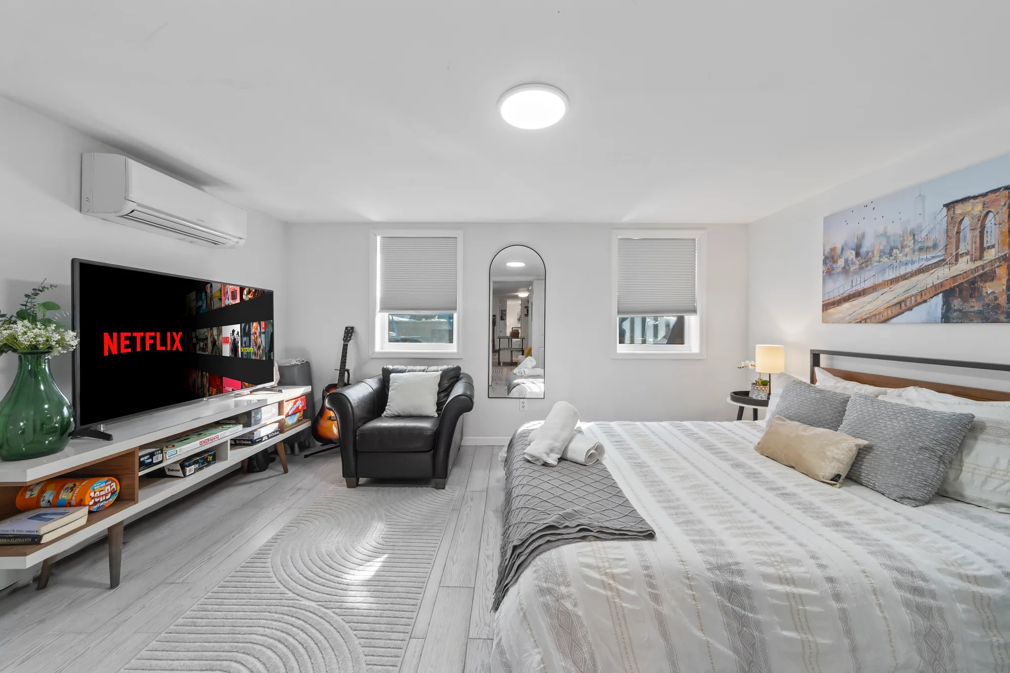 Bright furnished bedroom set up for short-term rental, Airbnb photography for a New York City unit with hospitality-spec HDR processing