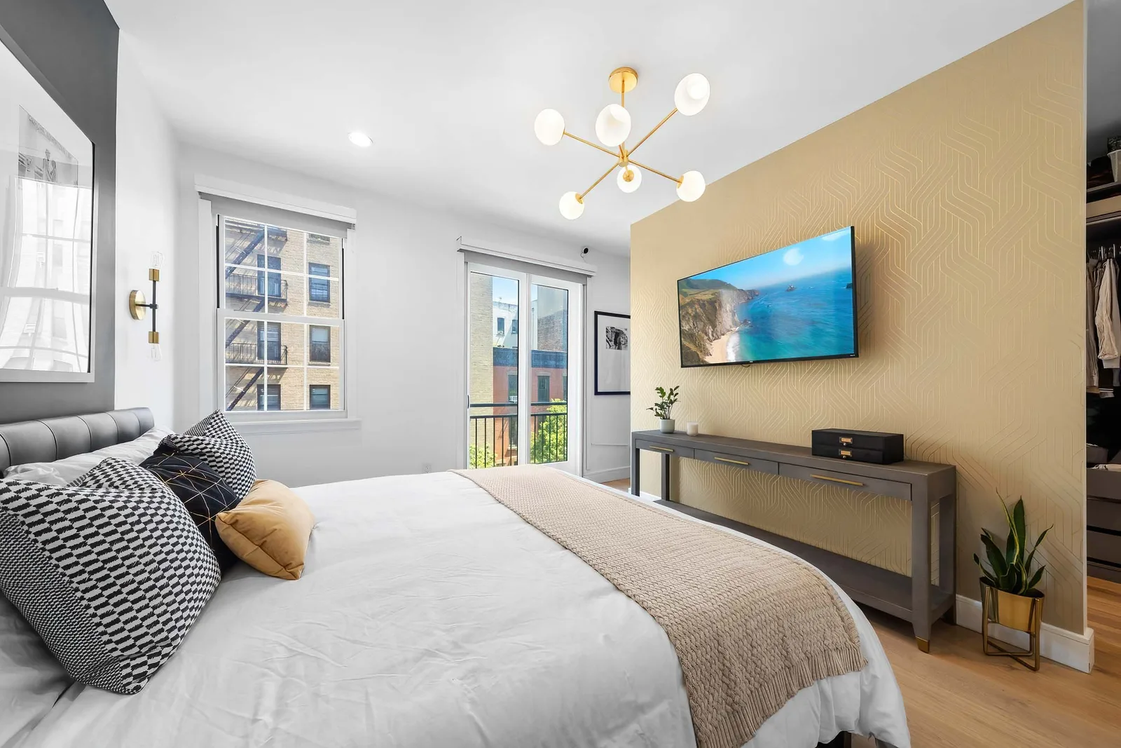 Furnished primary bedroom with a smart TV in a New York City short term rental, professional photography of high quality images for a vacation rental Airbnb listing