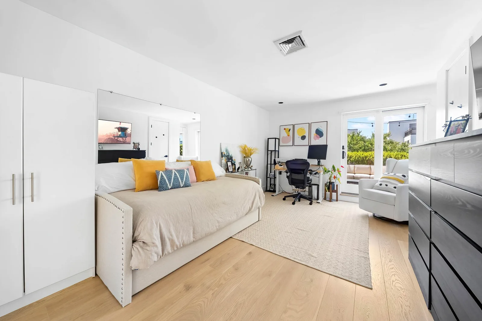 Bright bedroom with home office and terrace shot for real estate photography on a New York City listing for potential buyers