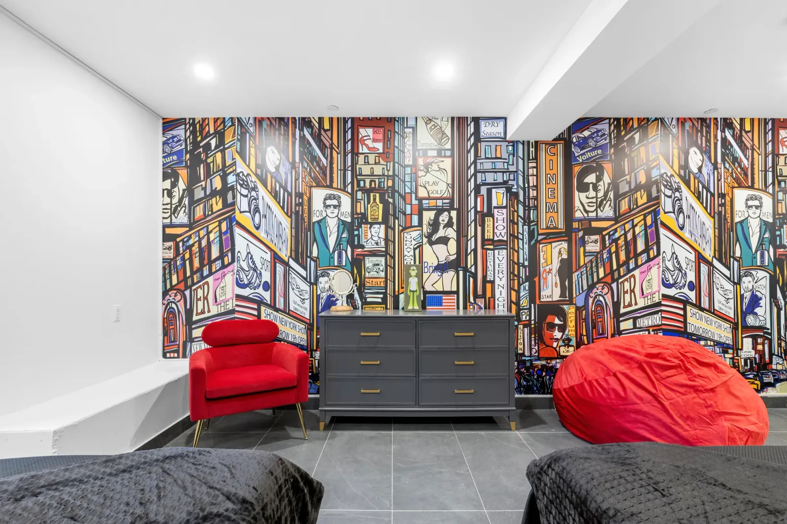 Lower-level rec room with a New York City mural in a Queens multi-family home, real estate photography with floor plan documentation