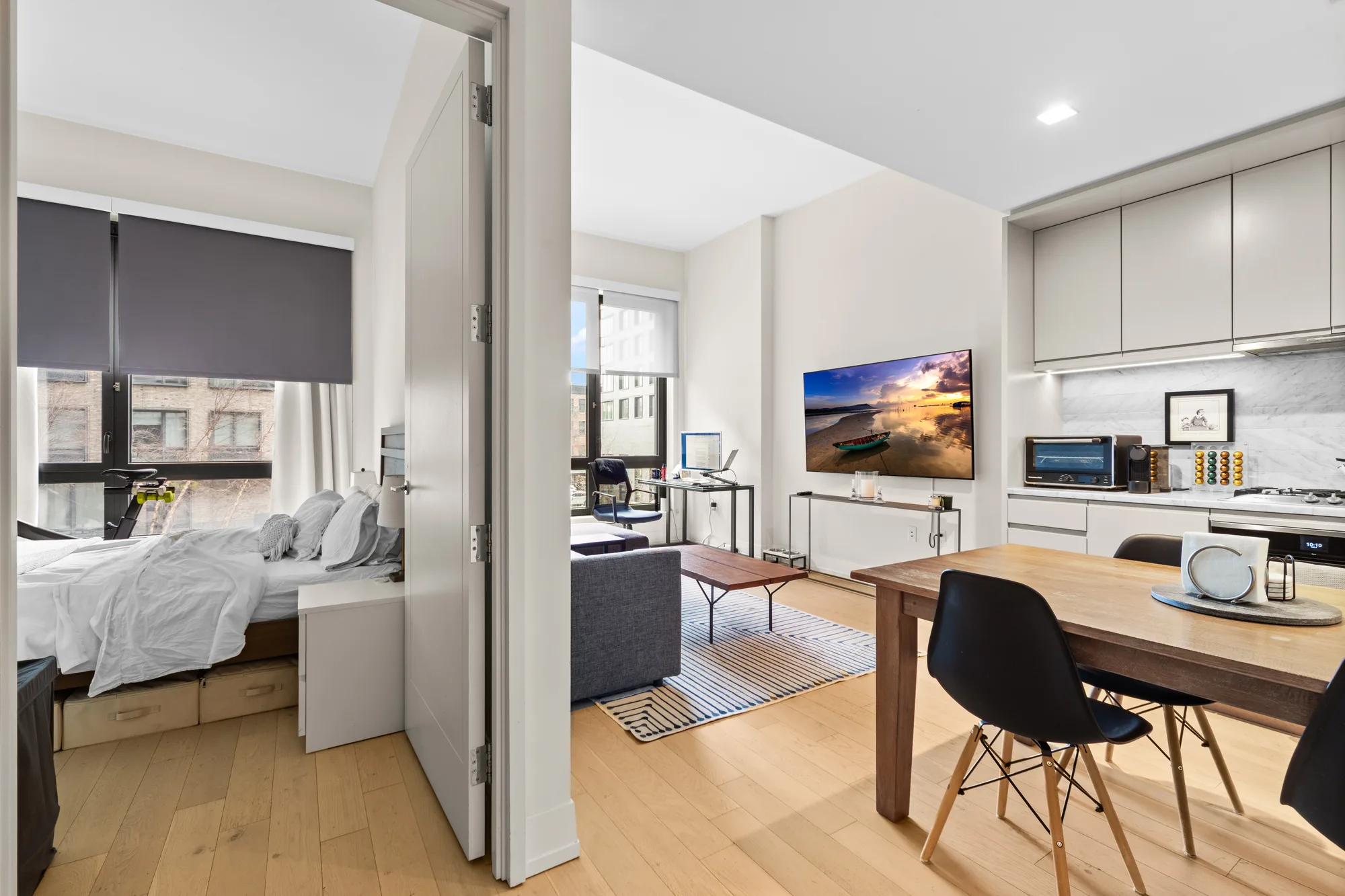 Studio apartment with bedroom and kitchen shot for real estate photographers marketing compact New York City apartments
