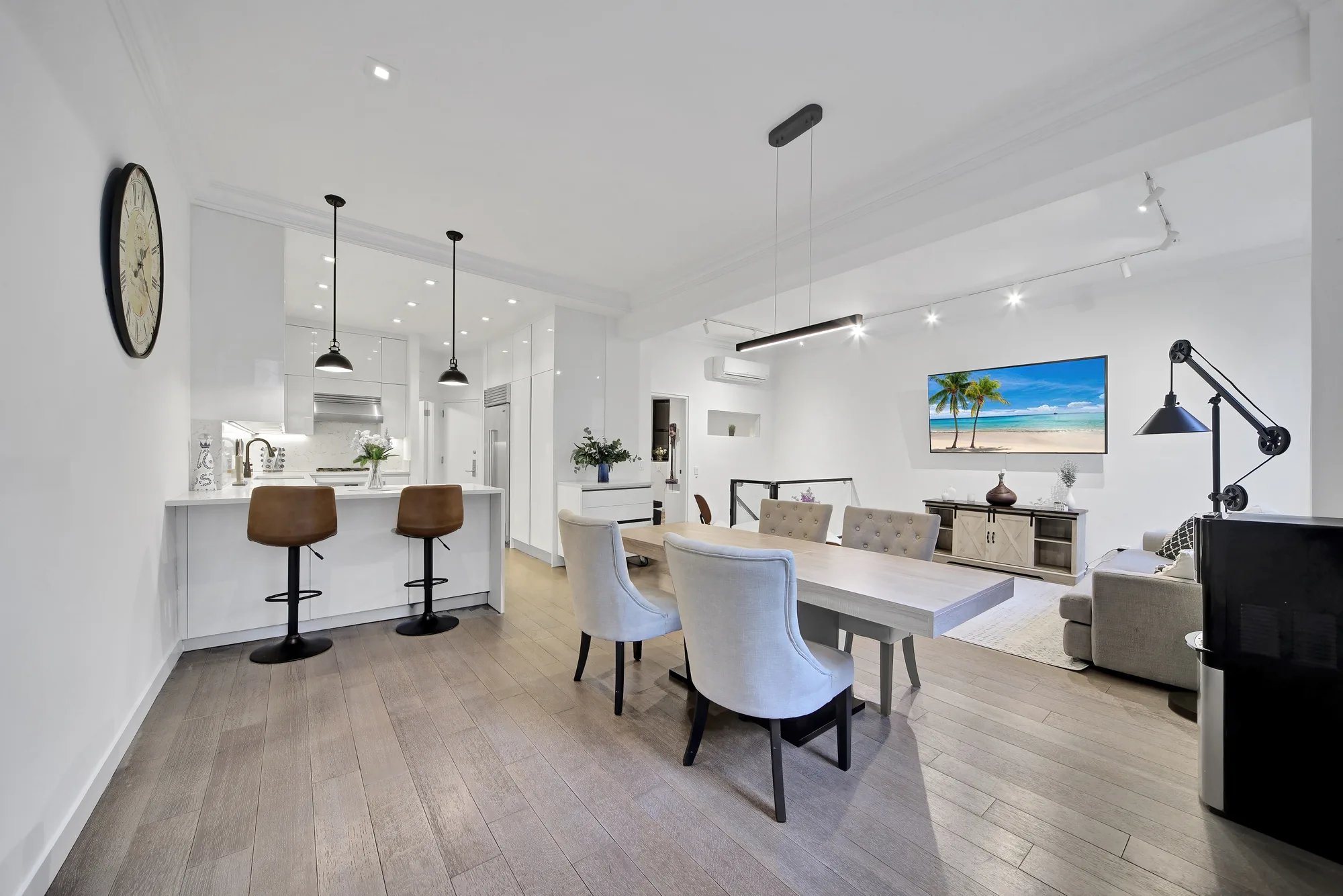 Open kitchen and dining great room shot for a real estate video walkthrough in New York City