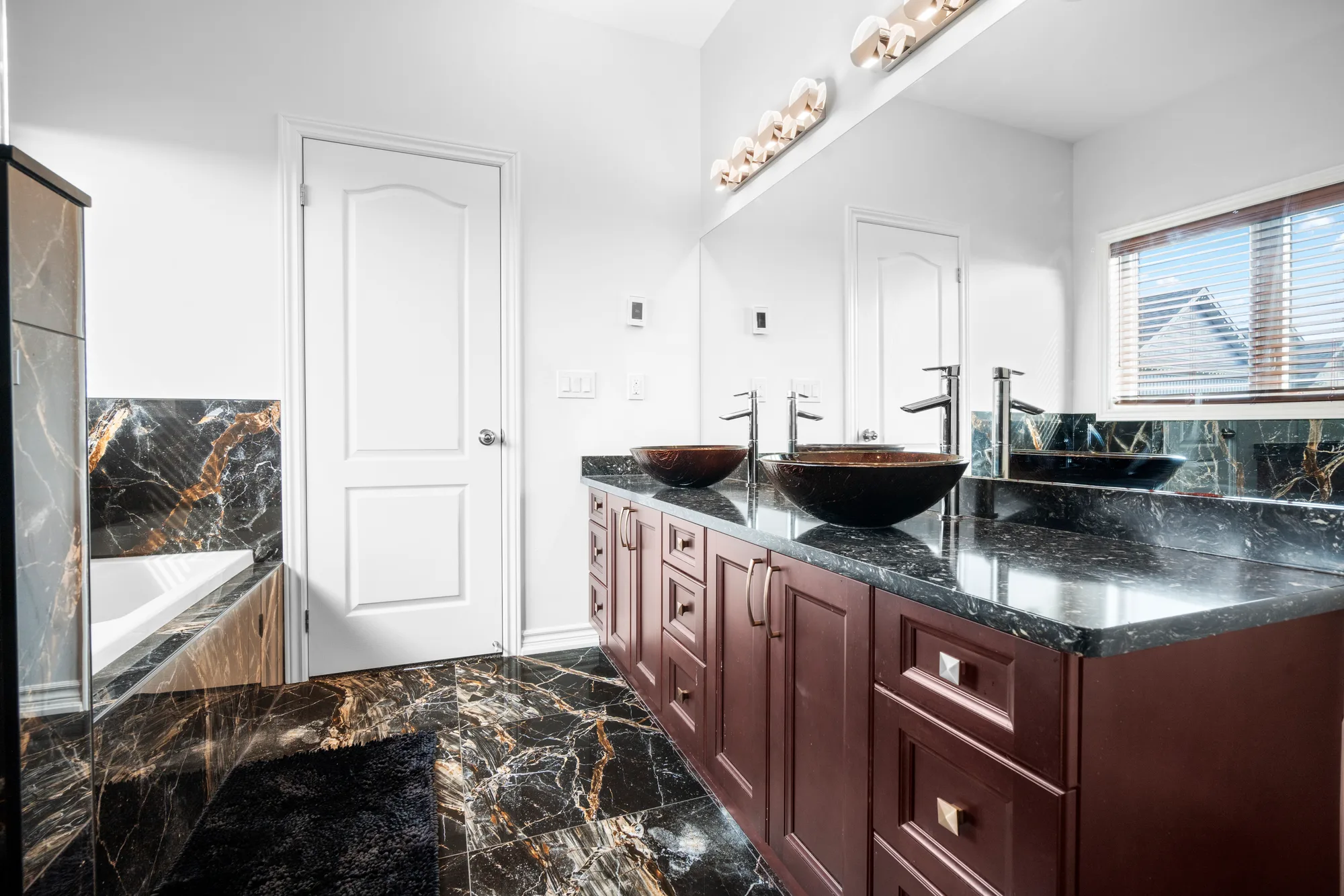 Floating staircase and hardwood landing photographed for a higher-end Bronx home listing, real estate photography in New York City