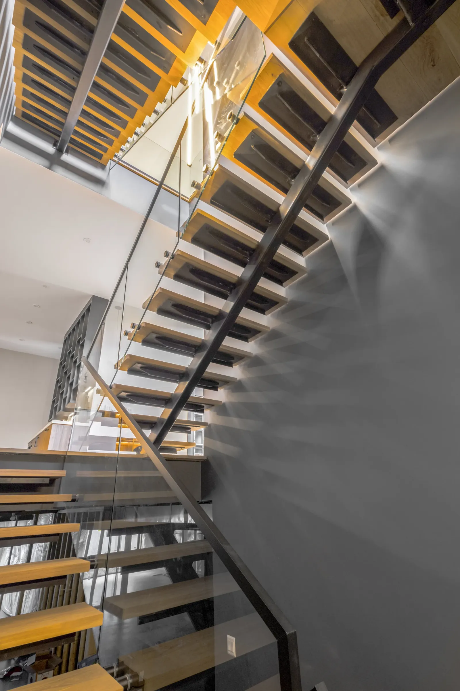 Floating staircase captured along the path of a continuous 4K real estate video walkthrough in New York City