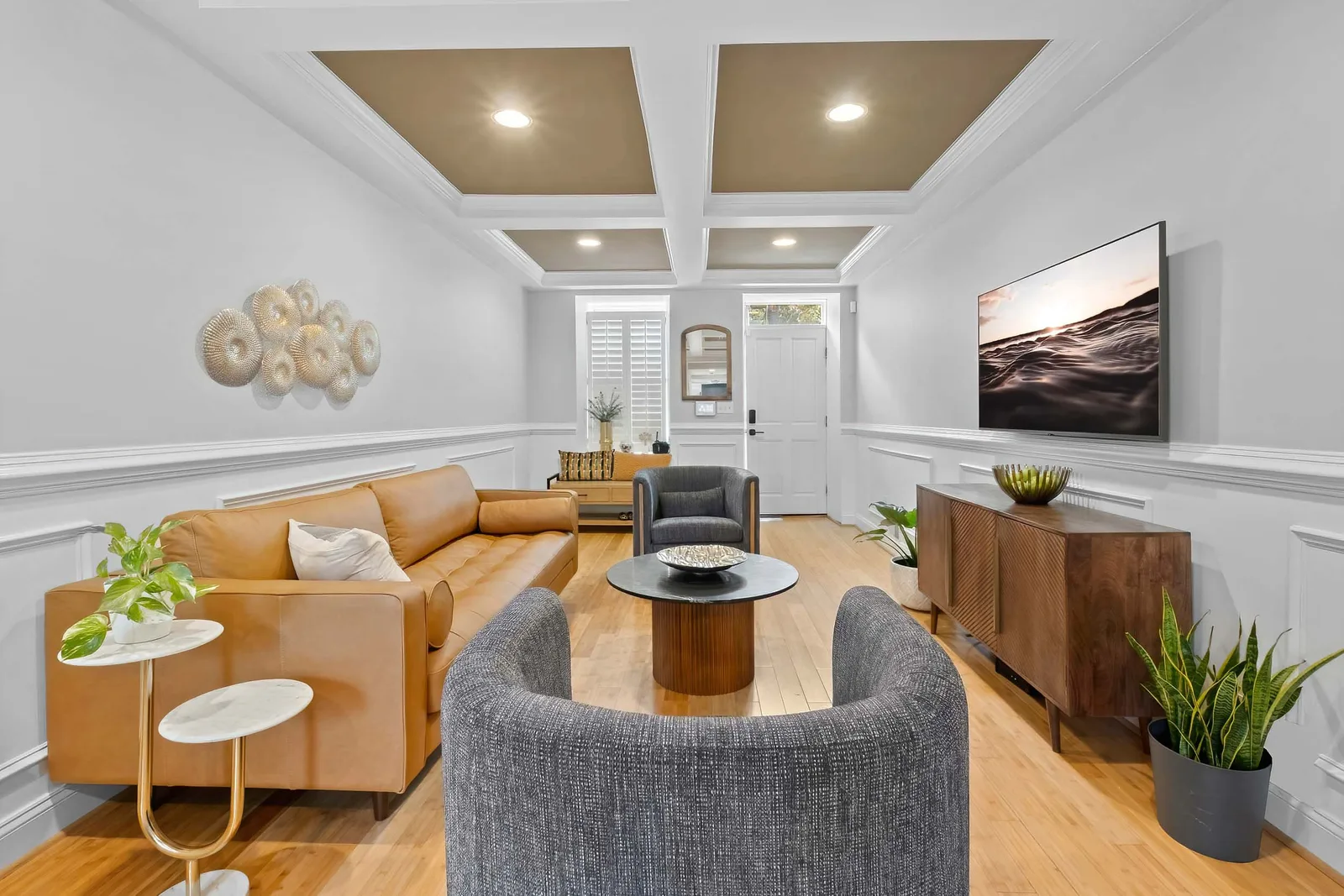 Staged living room with a coffered ceiling shot by a real estate photographer in Baltimore