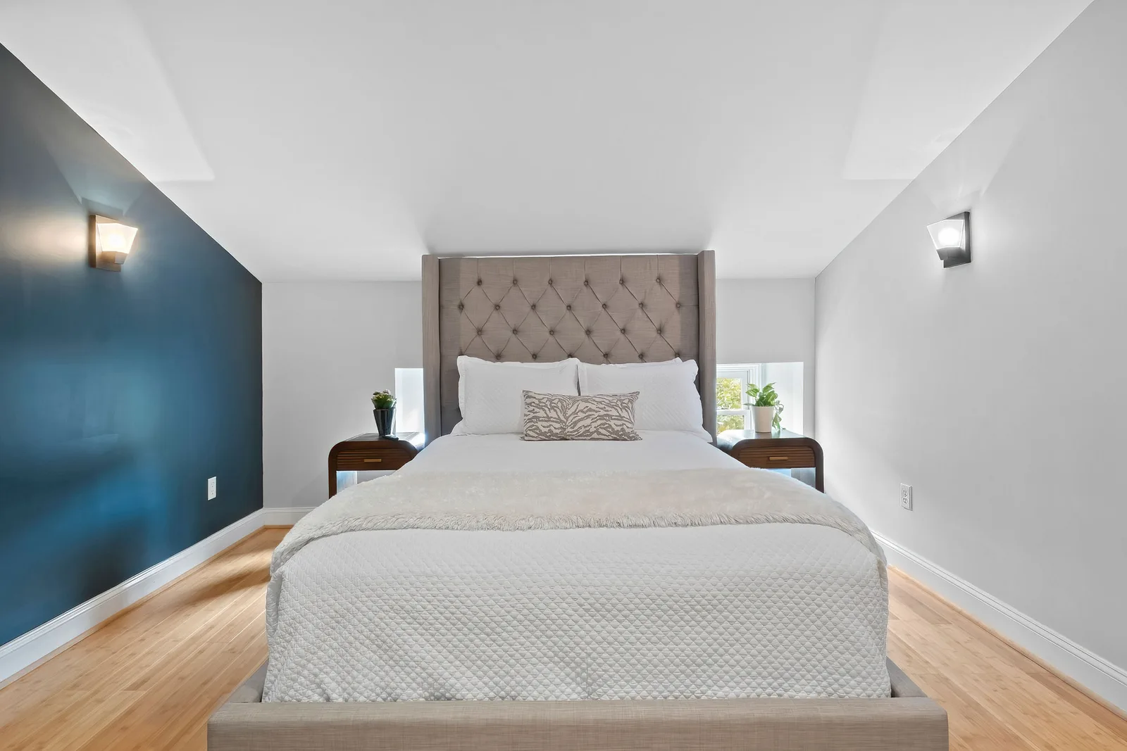 Bright bedroom with accent wall photographed for a New York City real estate photography listing apartment