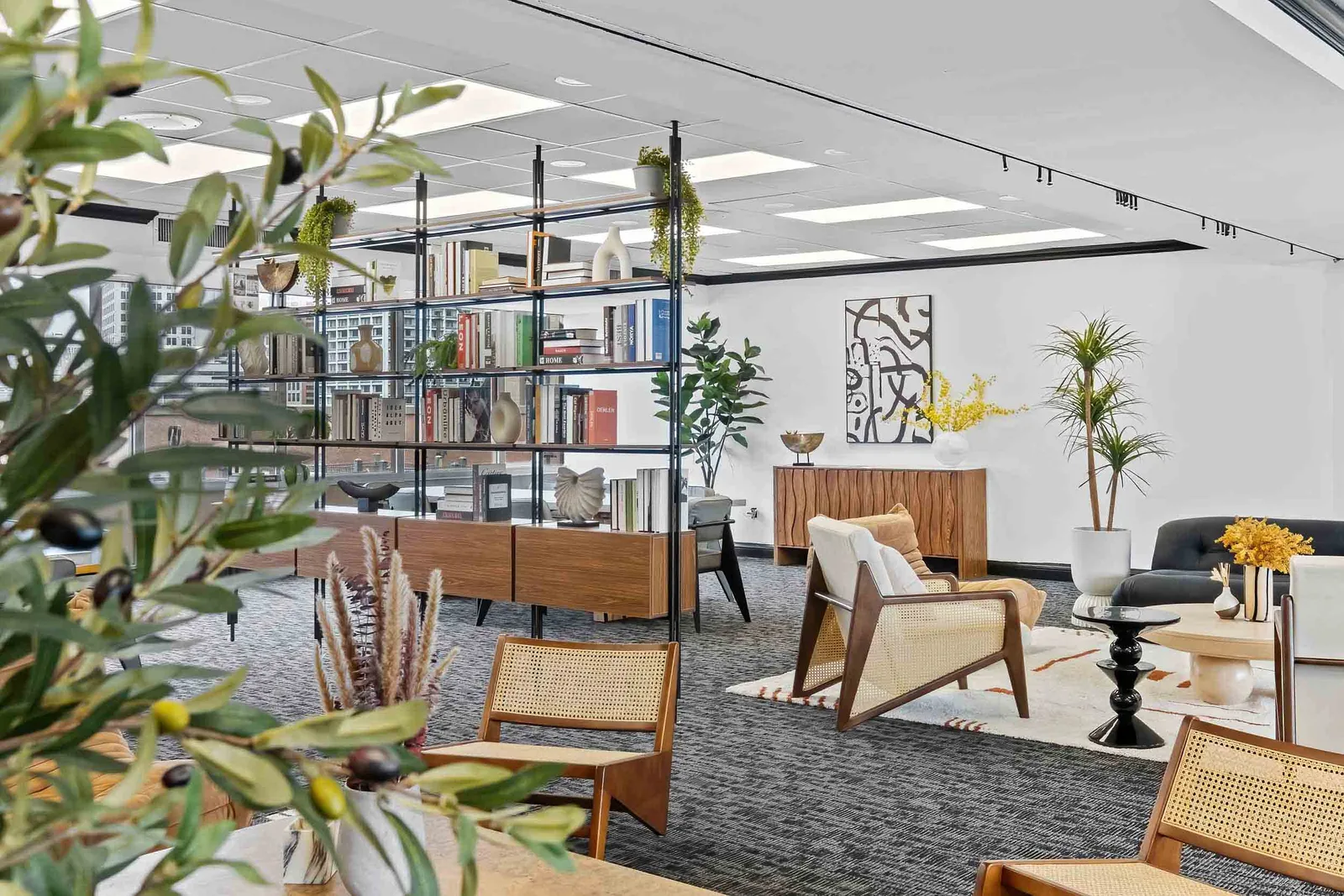 Open-plan office lounge with a New York City skyline view, photographed for a commercial real estate listing by OpenDoors360