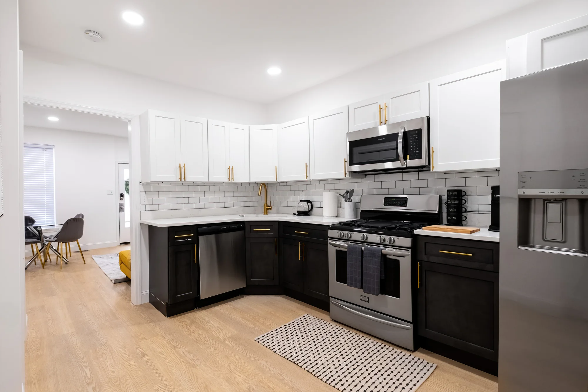 Two-tone Gough Street rowhome kitchen shot for a Baltimore real estate listing, listing photography that gives potential buyers a clear read on the home