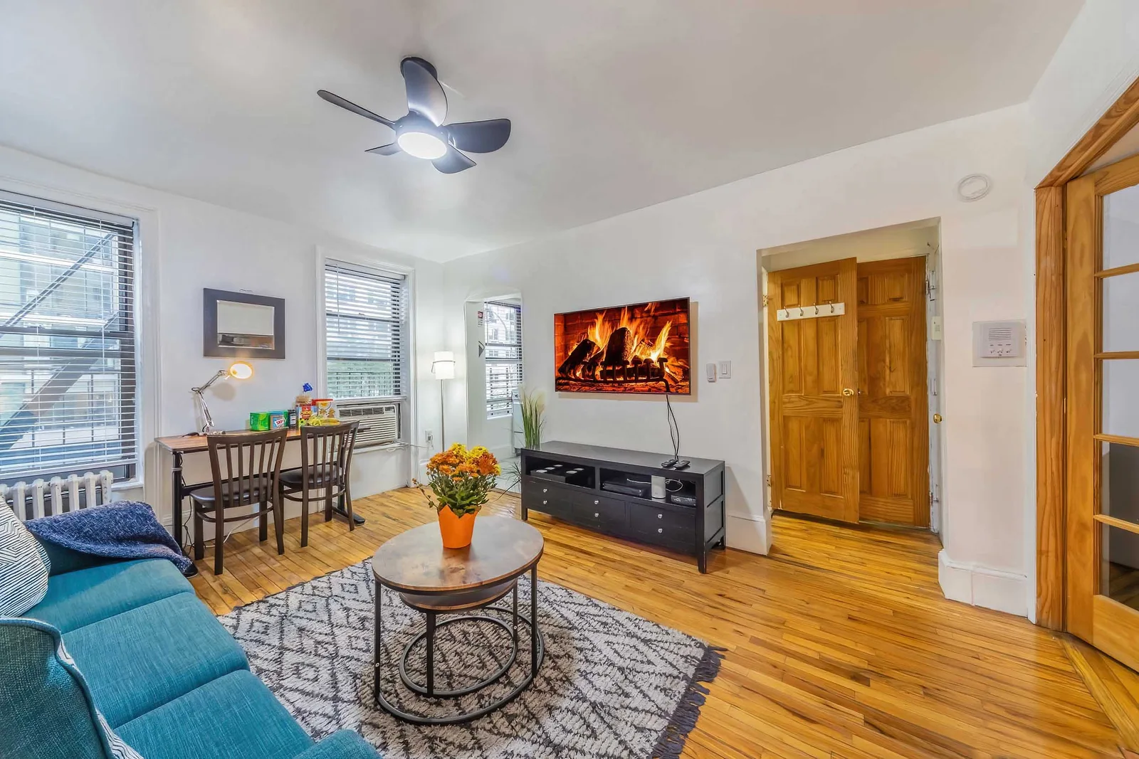 Cozy furnished living room shot for short-term rental real estate photography, the kind of inviting interiors that lift bookings on online listings