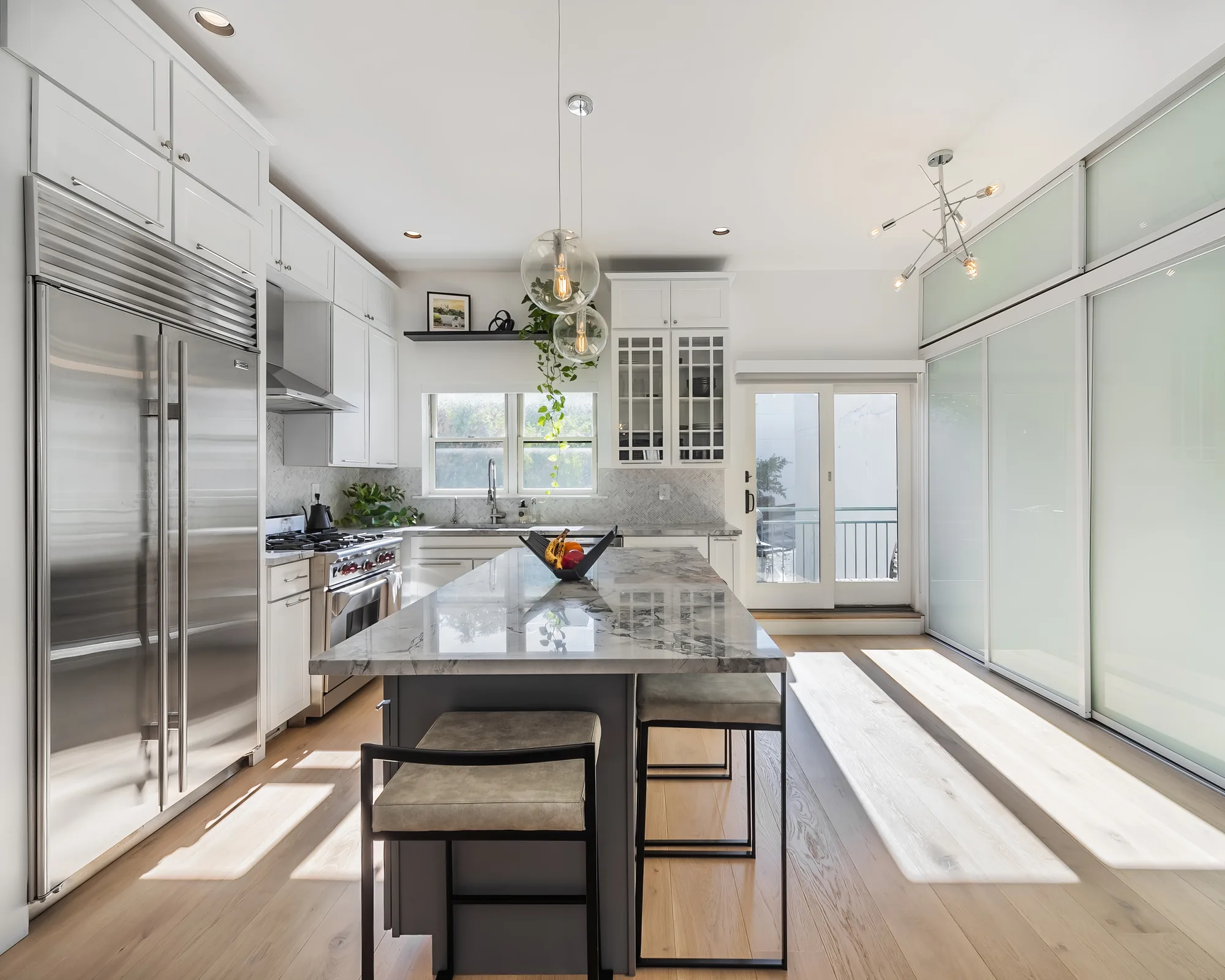 Marble island kitchen captured with professional real estate photography, the kind of final images that help expert photographers showcase luxury homes in New York City