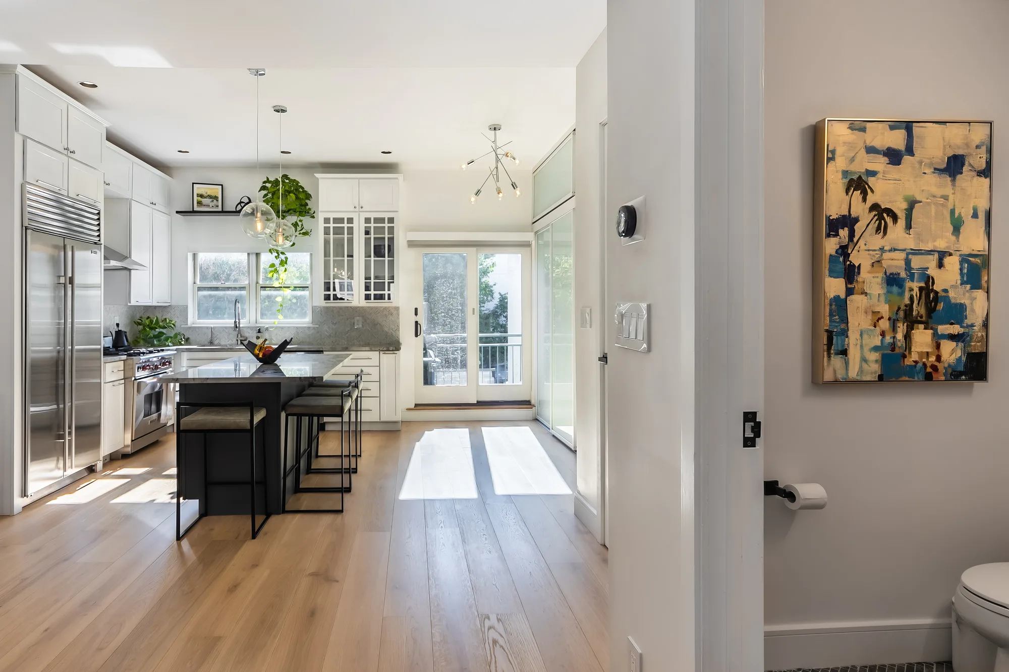 Modern kitchen with a center island in a New York City listing, professional real estate photography by OpenDoors360