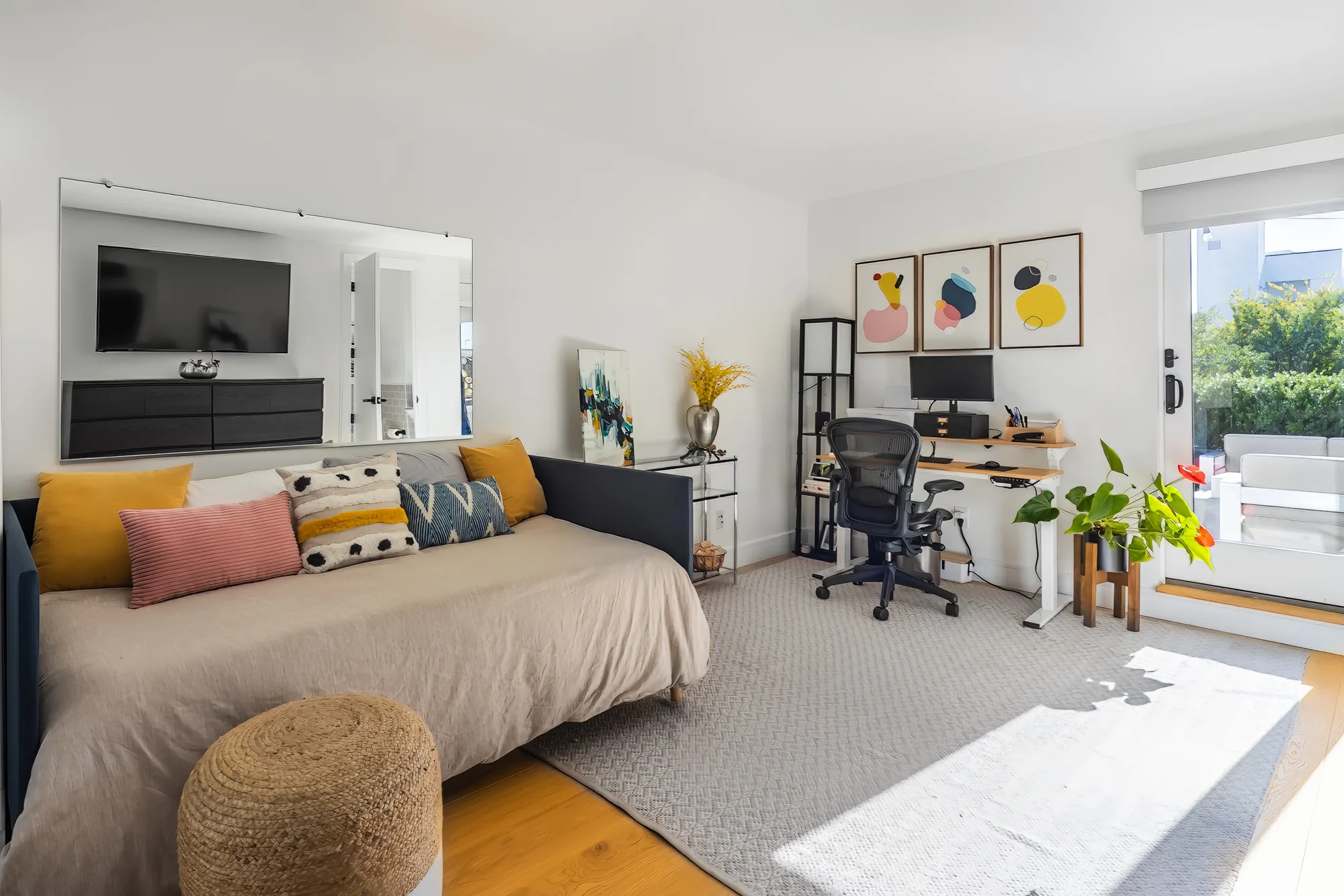 Studio apartment with a daybed and work desk, captured for a New York City 360 virtual tour buyers can view on mobile or desktop