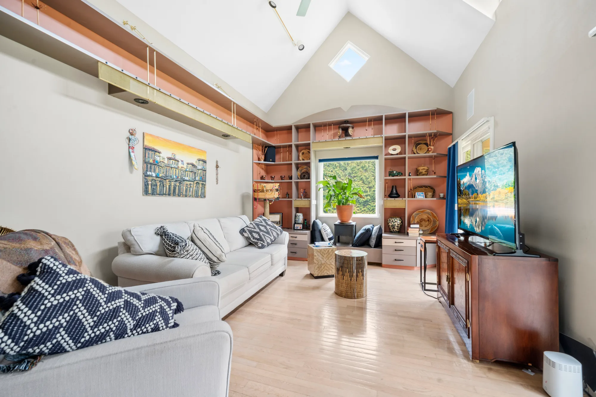 Vaulted living room with built-ins, straightened verticals and corrected color after five-stage processing, real estate photography in Baltimore