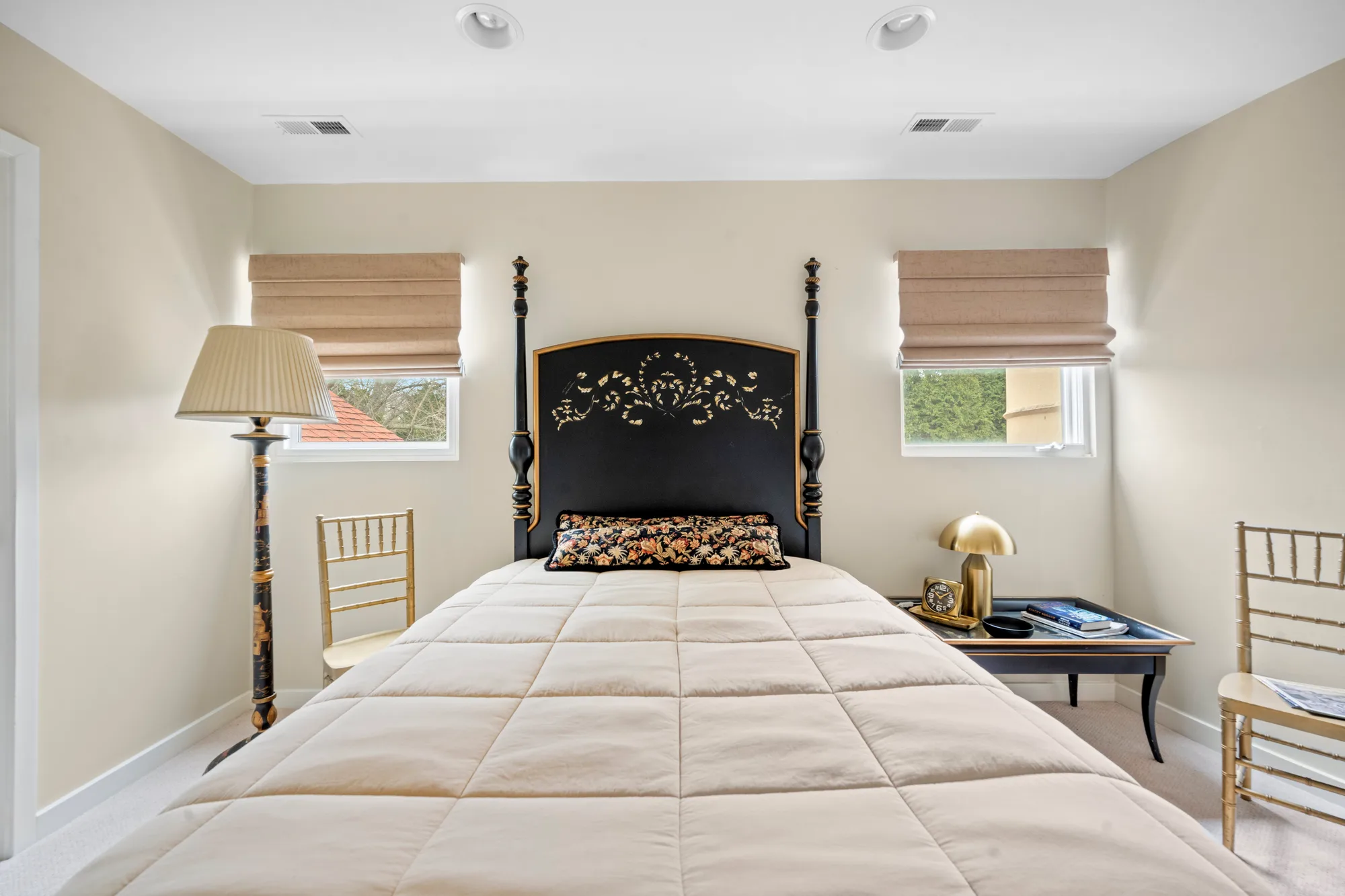Guest bedroom with a four-poster bed in a Baltimore short term rental, short term rental photography of the rooms a host lists on Airbnb and Booking.com
