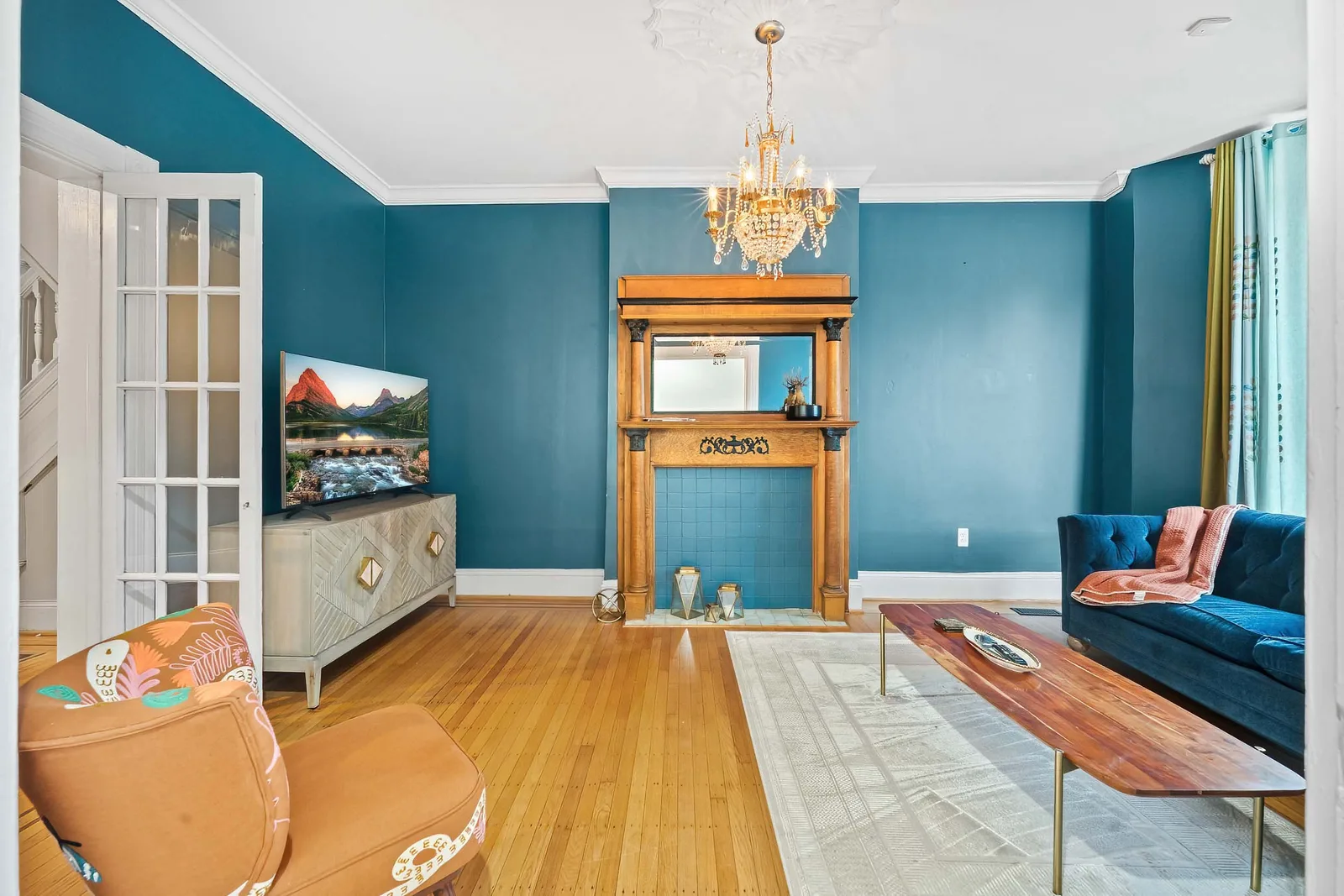 Parlor-floor living room with original mantel shot for a Brooklyn real estate photography listing that draws potential buyers
