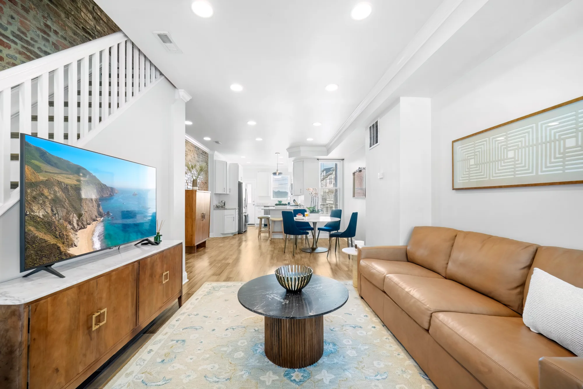 Open-plan living and dining area in a furnished rental, professional photography for high quality images of a short-term rental in New York City
